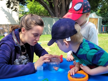 Camille showing moths at Playgroup