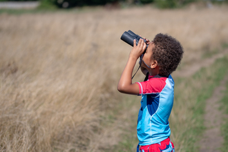 Child with binoculars 