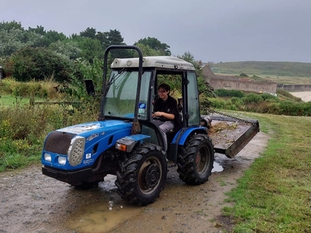 Poppy on the little blue tractor