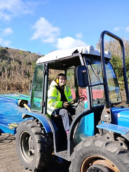 Poppy driving the blue tractor