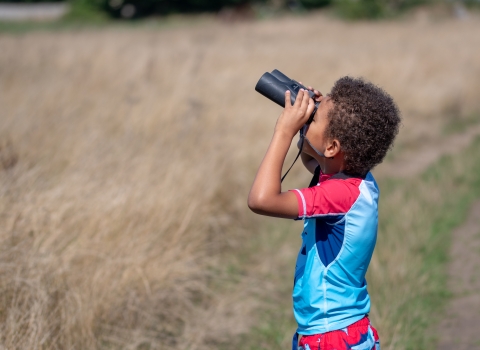 Child with binoculars 